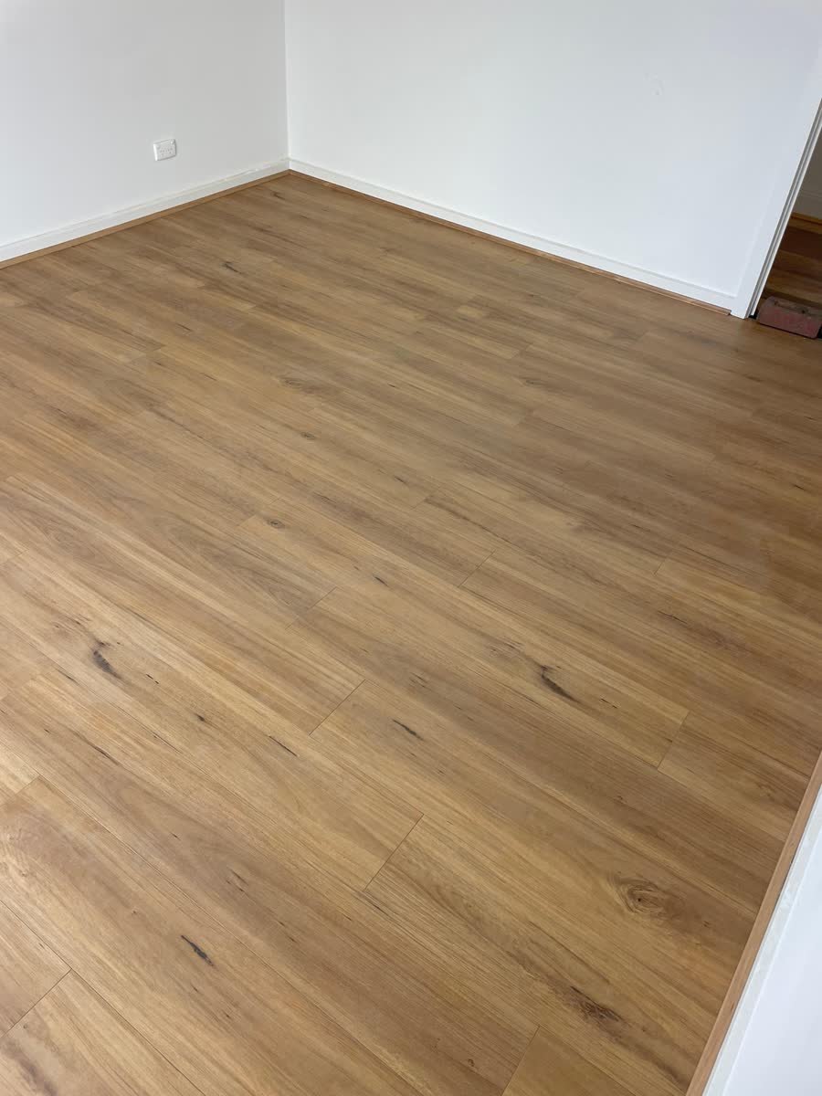 Completed honey-toned timber flooring in a Melbourne home